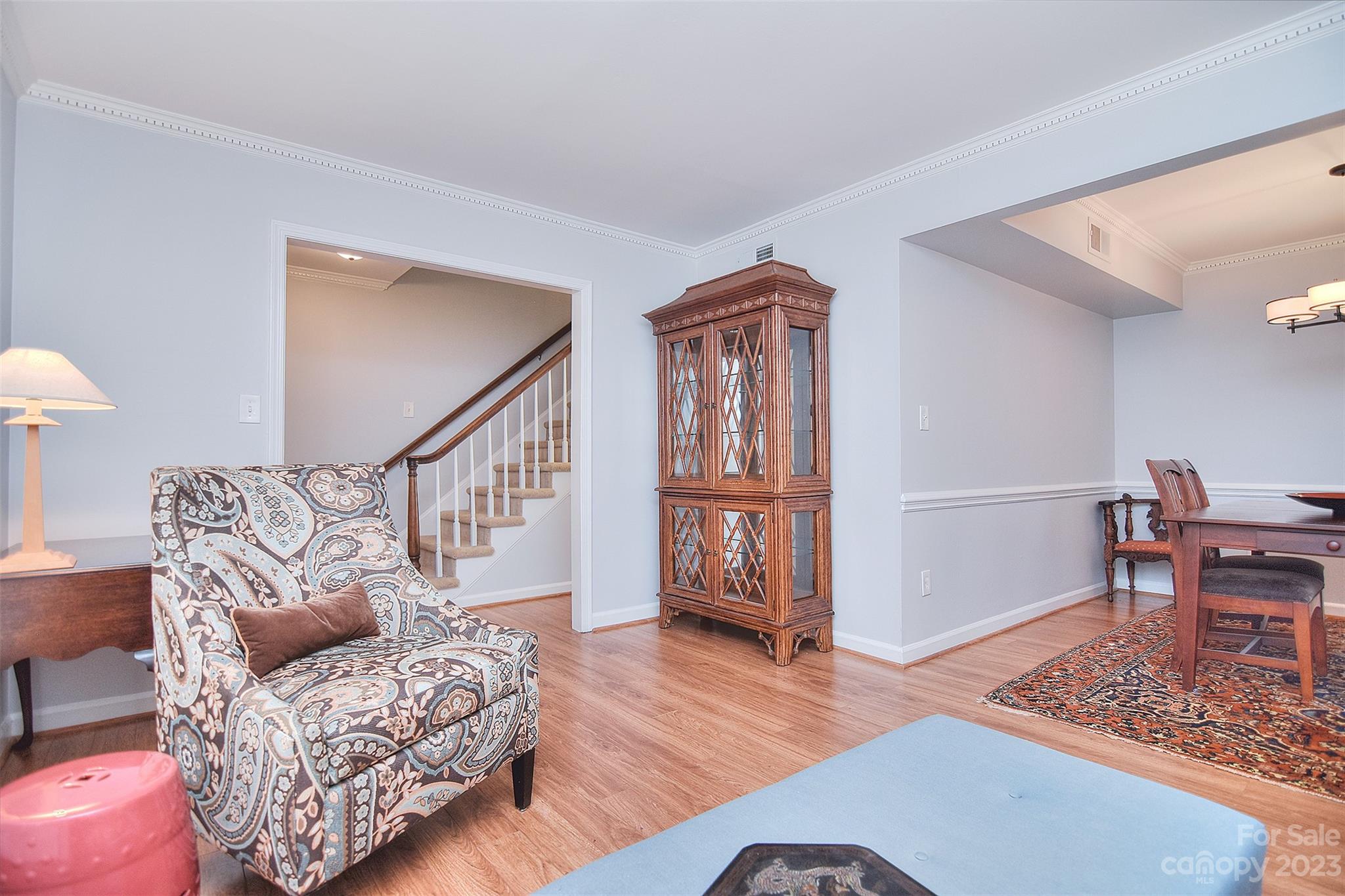4415 Simsbury Road Charlotte, NC 28226 - Photo 6 of 36 a living room with furniture and a wooden floor