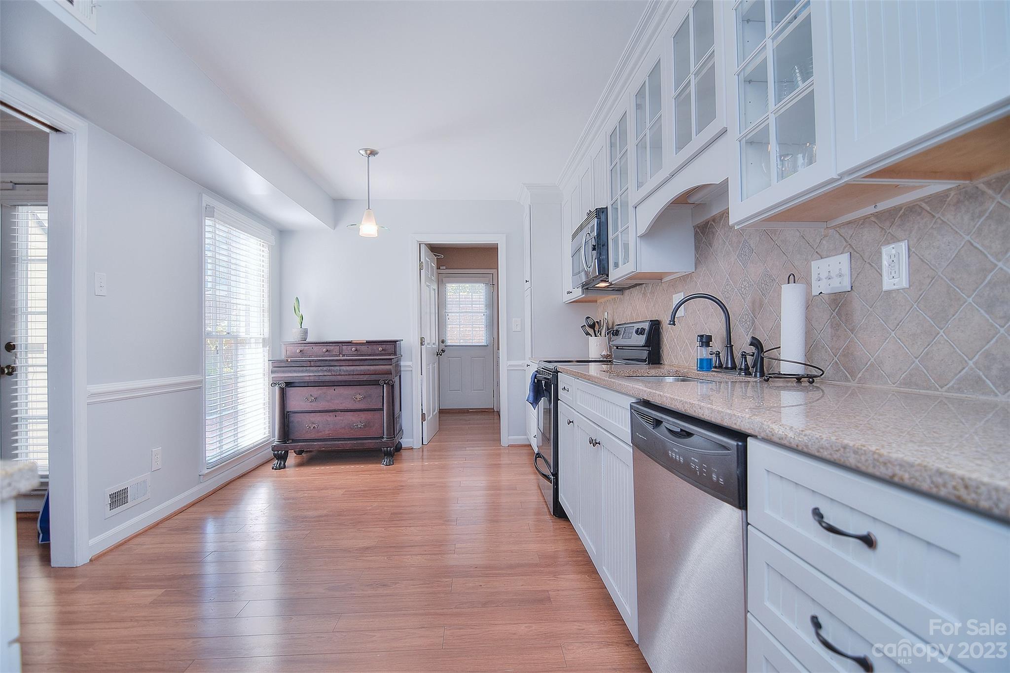 4415 Simsbury Road Charlotte, NC 28226 - Photo 10 of 36 a kitchen with a sink and cabinets