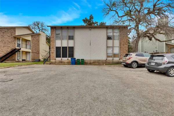 a view of a car park in front of house
