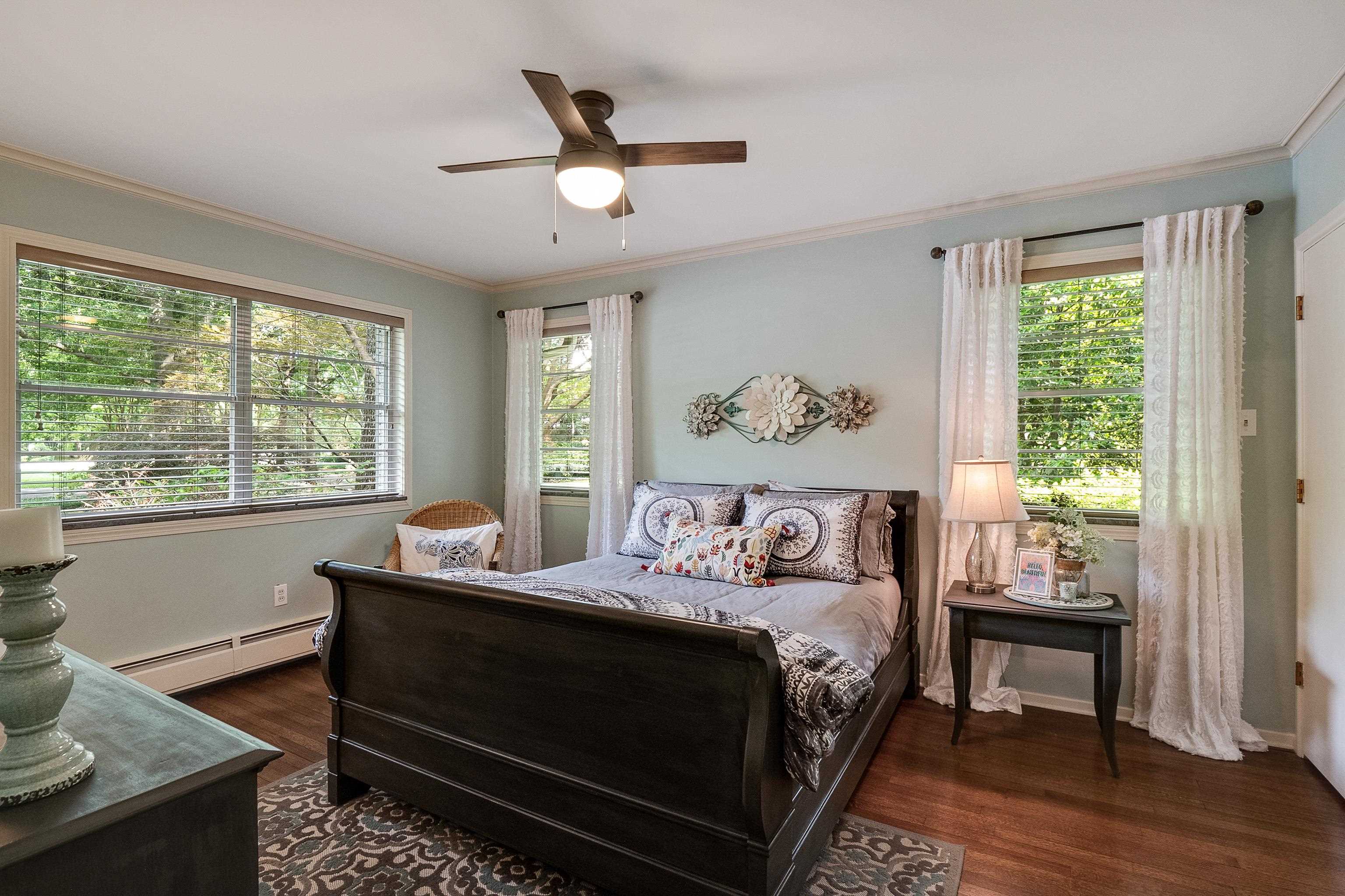 45 South Rose Road Memphis, TN 38111 - Photo 16 of 25 a bed sitting in a bedroom next to a window