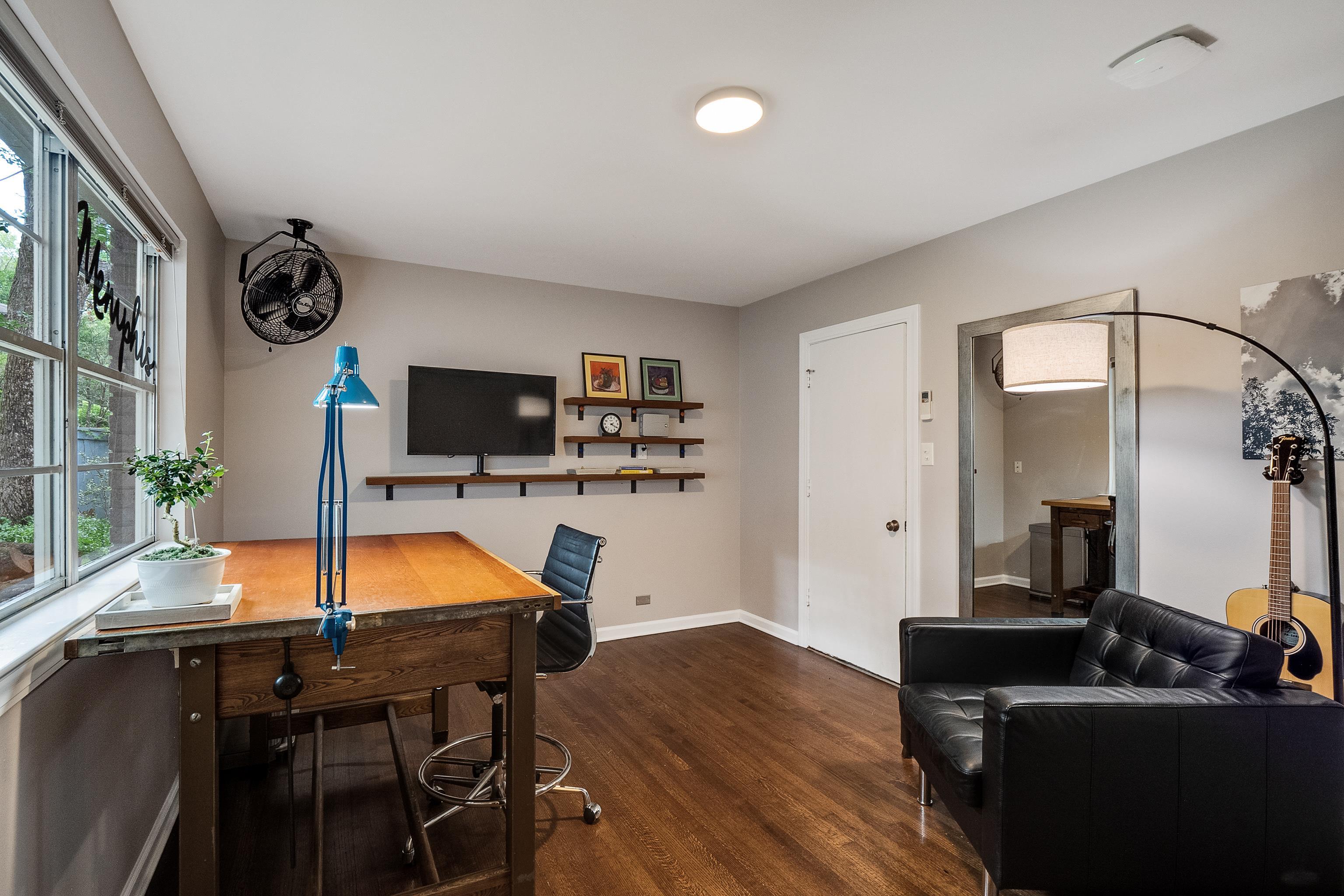 45 South Rose Road Memphis, TN 38111 - Photo 21 of 25 a living room with furniture and a flat screen tv