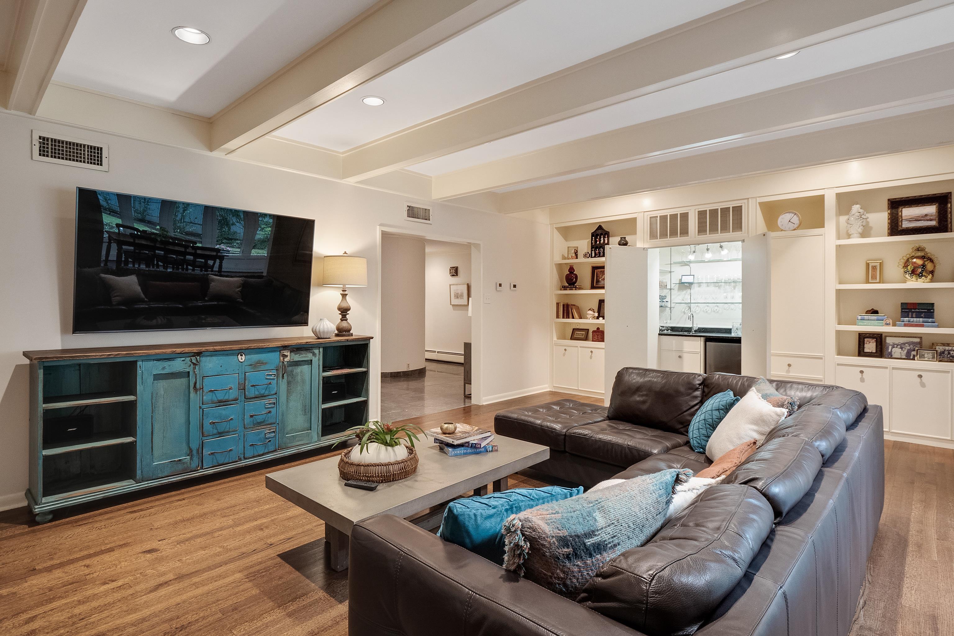 45 South Rose Road Memphis, TN 38111 - Photo 8 of 25 a living room with furniture and a flat screen tv