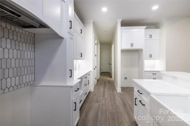 a bathroom with a sink a mirror and a shower