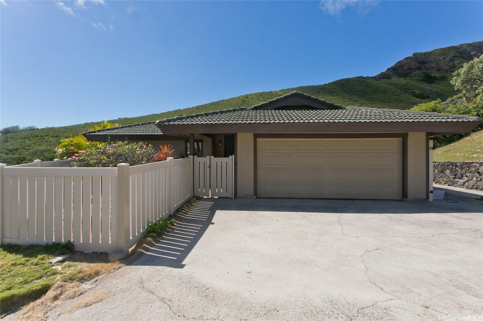 1015 Maunanani Street Honolulu, HI 96825 - Photo 1 of 22 a front view of a house with a garage
