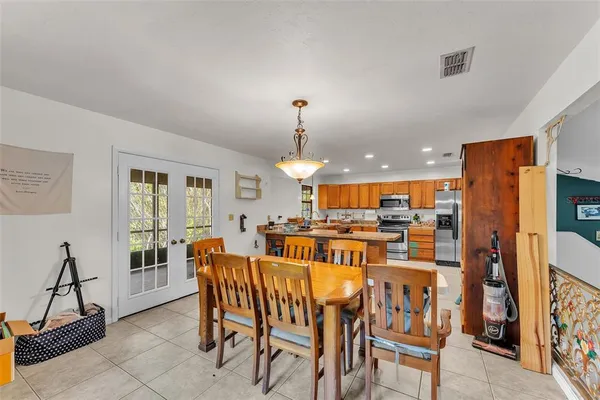 a view of a dining room with furniture window and outside view