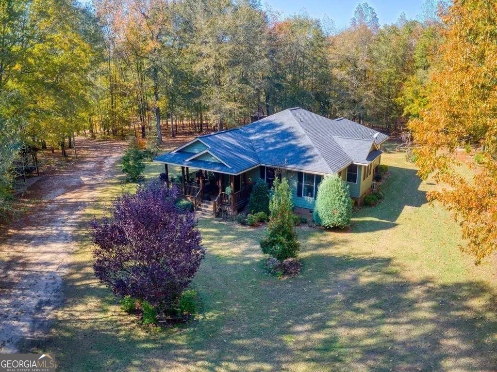 9144 River Road Mitchell, GA 30820 - Photo 1 of 1 a view of house with yard and outdoor seating