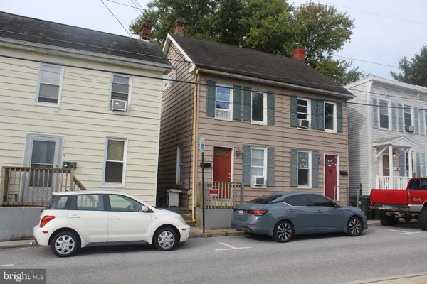 a car parked in front of a house