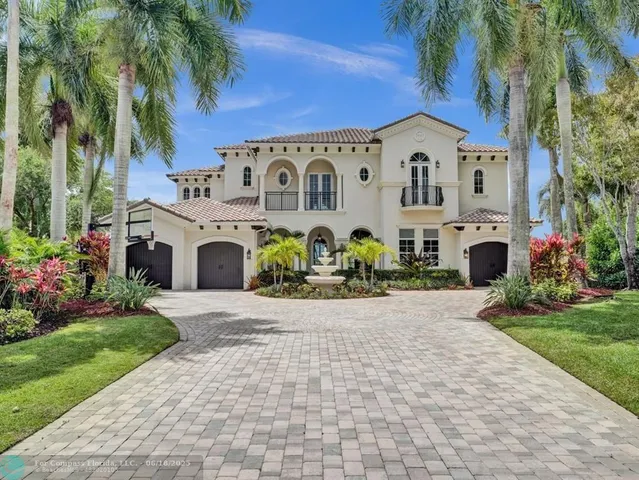 a view of a dining room with furniture a chandelier and wooden floor
