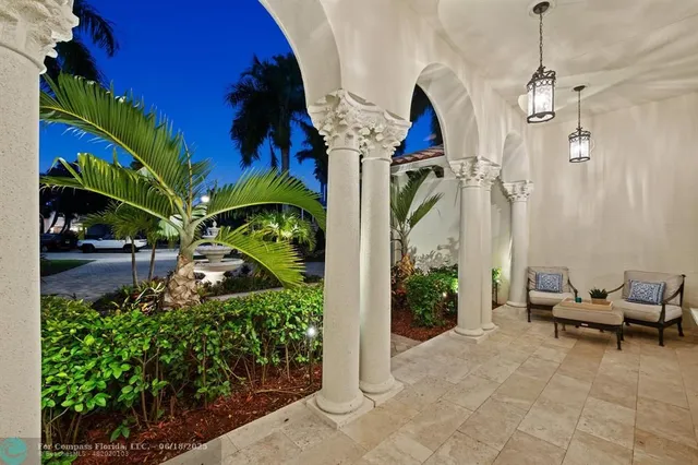 a large kitchen with stainless steel appliances a stove a sink dishwasher and a dining table with the living room view