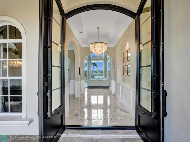 a living room with furniture and large window