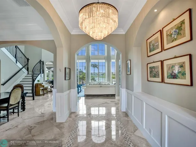 a kitchen with a refrigerator and a stove top oven