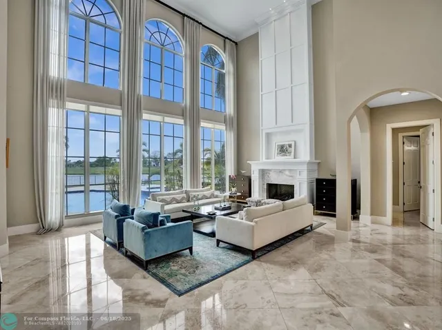 a kitchen with granite countertop a sink a stove and cabinets