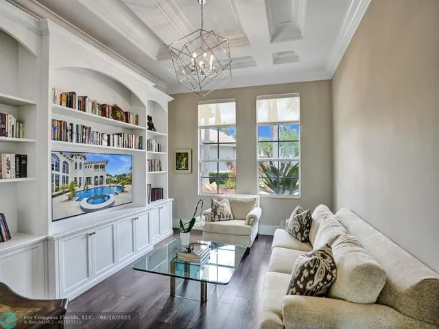 an aerial view of a house with a swimming pool yard and outdoor seating