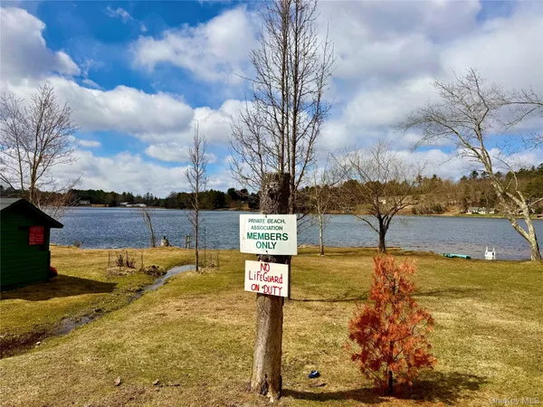 a view of a chairs in backyard of the house