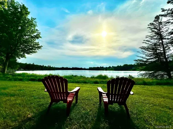 a view of a swimming pool with a yard