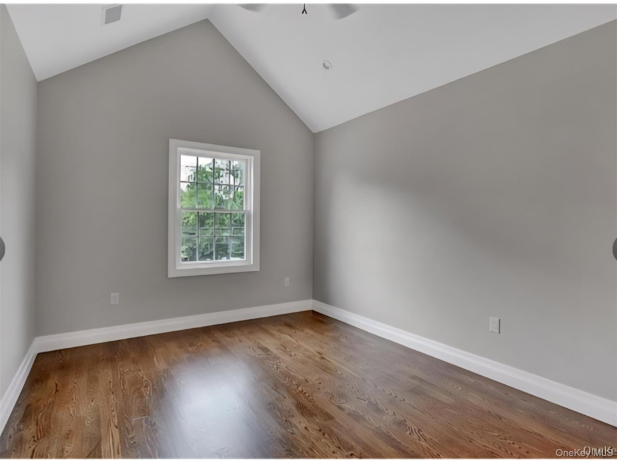 9 Linda Lane, Unit 101 Pearl River, NY 10965 - Photo 14 of 20 Bonus room with vaulted ceiling, a ceiling fan, and wood finished floors