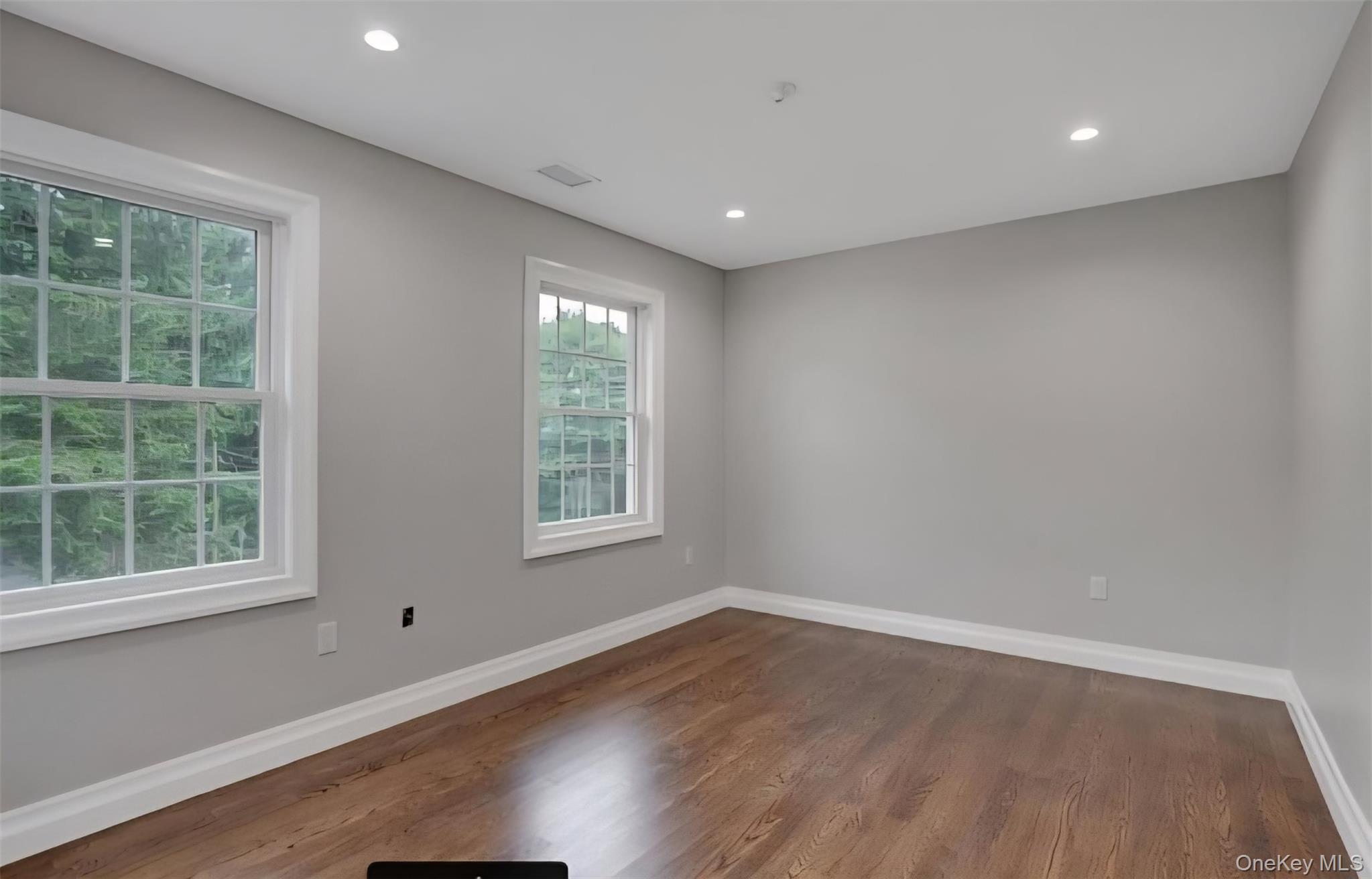 9 Linda Lane, Unit 101 Pearl River, NY 10965 - Photo 16 of 20 Empty room featuring wood finished floors and recessed lighting