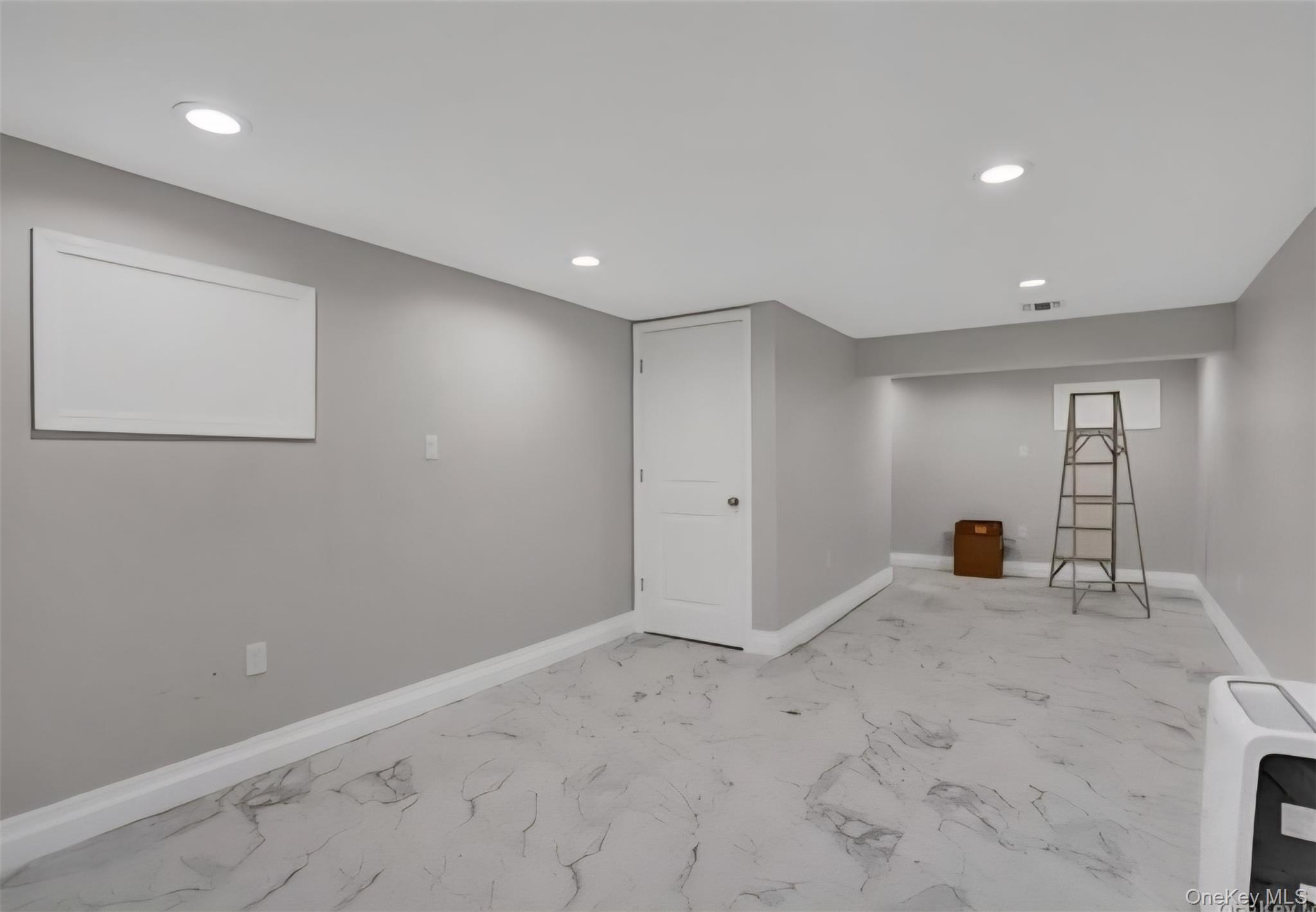 9 Linda Lane, Unit 101 Pearl River, NY 10965 - Photo 18 of 20 Finished below grade area featuring recessed lighting and light marble finish floors