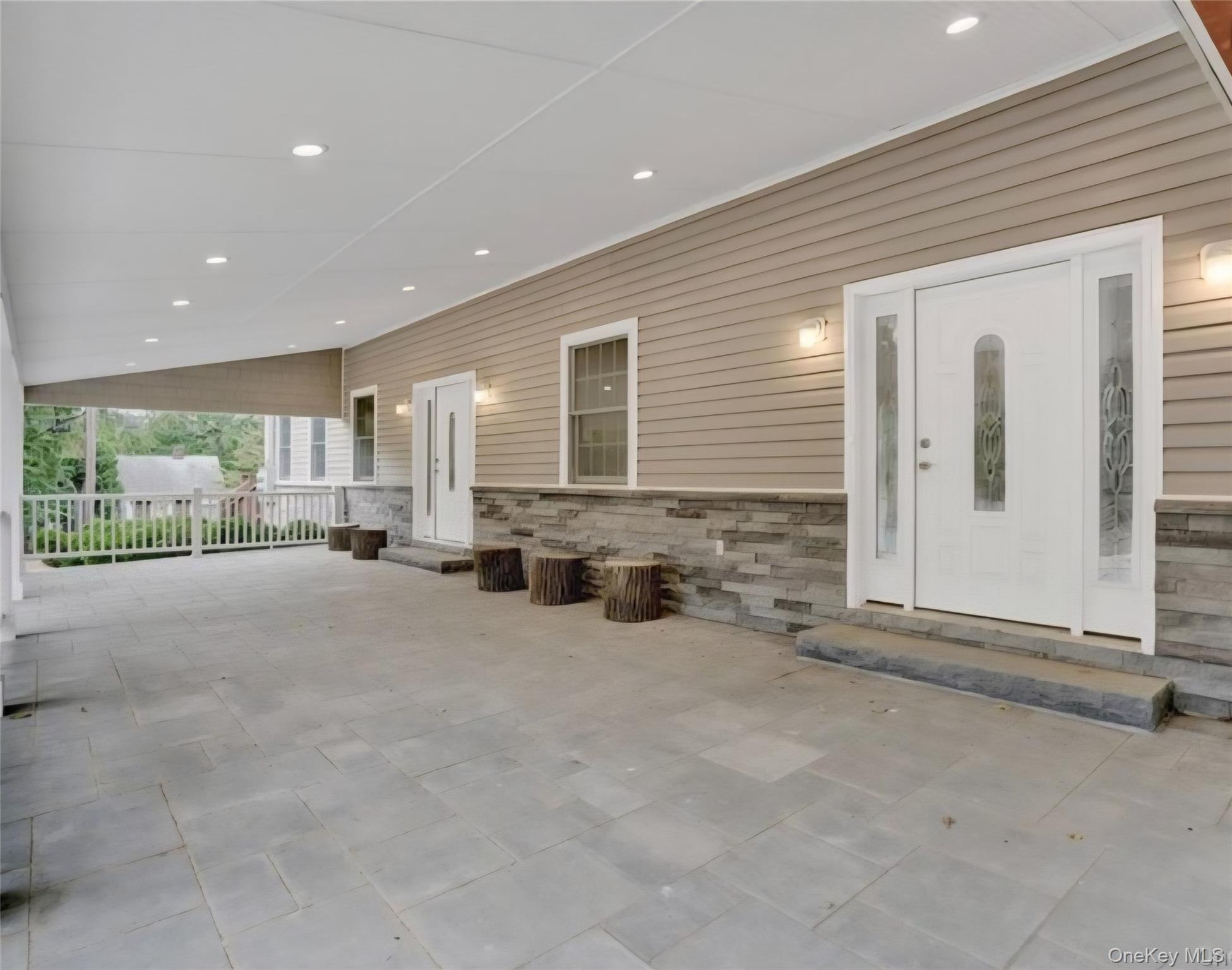 9 Linda Lane, Unit 101 Pearl River, NY 10965 - Photo 2 of 20 Entrance to property featuring stone siding and a patio