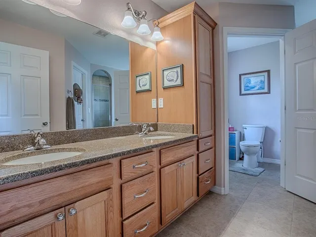 a view of a big yard with a tree in the background