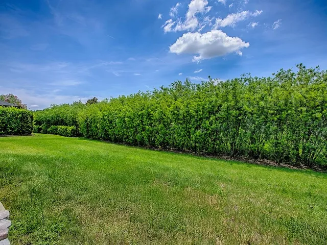 an aerial view of a house with a swimming pool