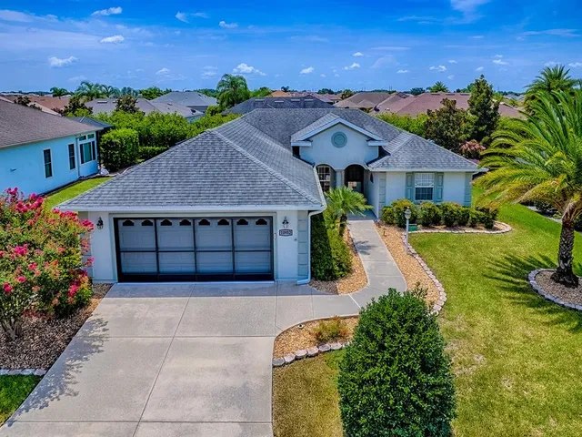 a view of a dining room with furniture and a potted plant