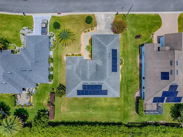 an aerial view of a house with a garden