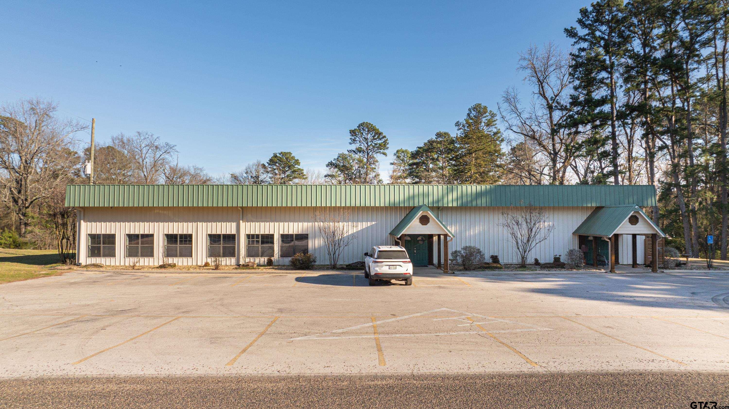 144 King Lyle Road Scroggins, TX 75480 - Photo 47 of 48 a house with trees in front of it