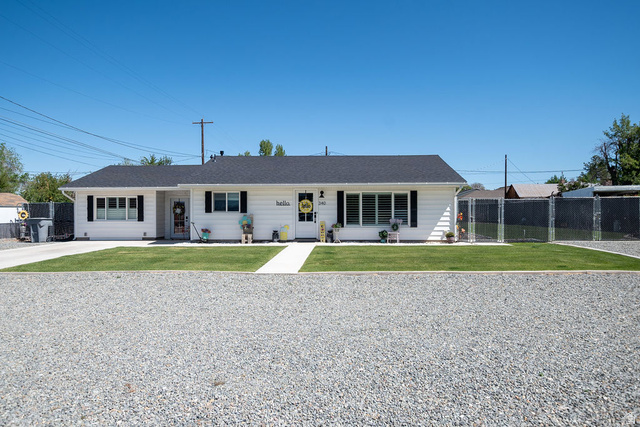 340 West 100 N Street Beaver, UT 84713 - Photo 1 of 37 White horizontal siding exterior with a dark asphalt shingle roof