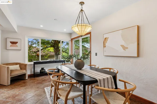 a view of a dining room with furniture window and outside view