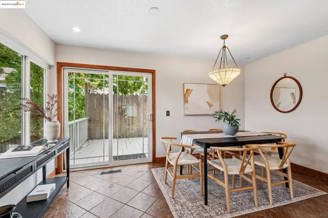 a view of a dining room with furniture window and outside view