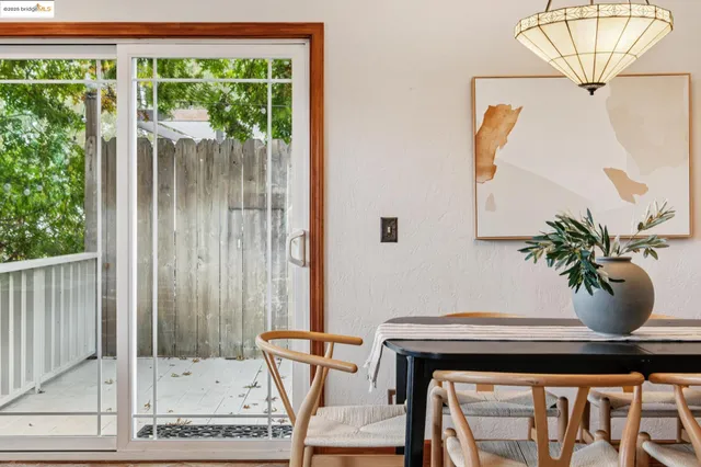a view of room with furniture and a potted plant