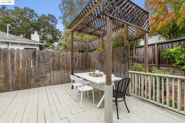 a view of a table and chairs on the roof deck
