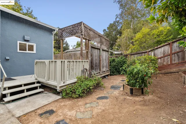 a view of a porch with wooden floor and fence