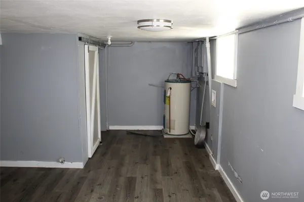 an empty room with wooden floor