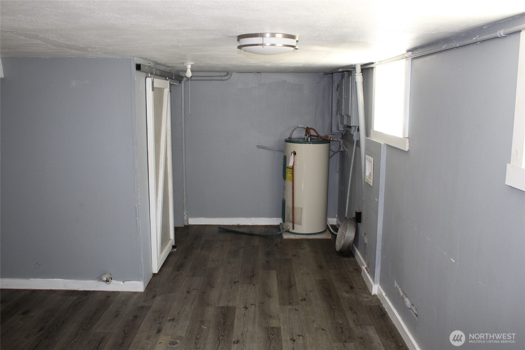 104 East 5th Avenue Ritzville, WA 99169 - Photo 13 of 19 an empty room with wooden floor