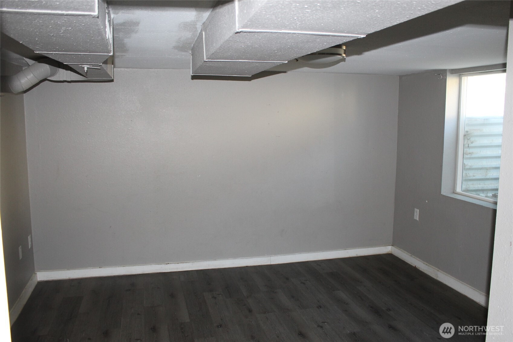 104 East 5th Avenue Ritzville, WA 99169 - Photo 16 of 19 a view of a room with wooden floor
