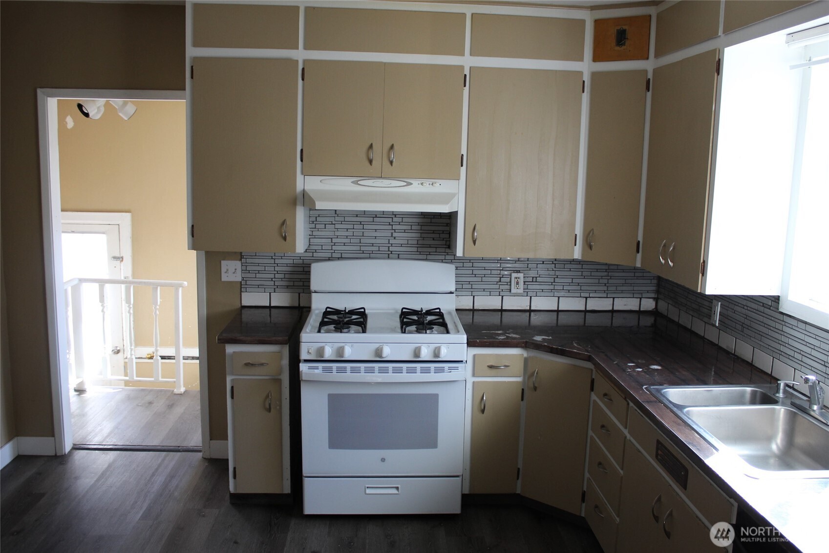 104 East 5th Avenue Ritzville, WA 99169 - Photo 8 of 19 a kitchen with a sink stove and cabinets