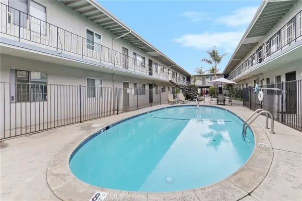 swimming pool view with a outdoor seating