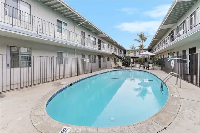 swimming pool view with a outdoor seating