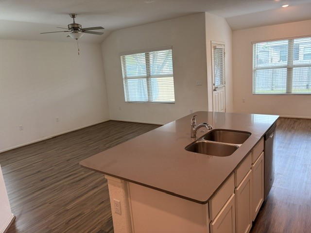 6917 Colorado Bluffs Road Austin, TX 78744 - Photo 5 of 19 a kitchen with a sink stove and cabinets