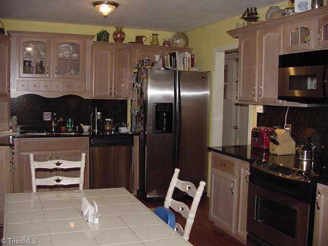 404 Robin Road Mount Airy, NC 27030 - Photo 3 of 9 Other. Kitchen w/granite countertops and d/w, stove, microwave & ref. stay!