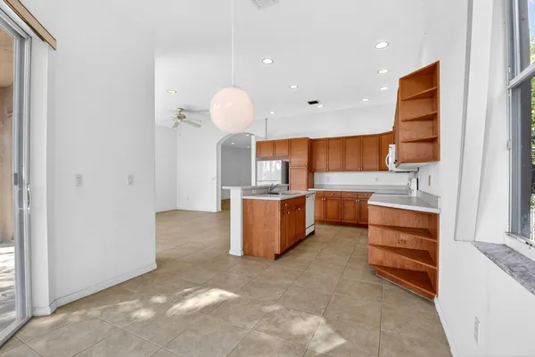 wooden floor in kitchen and a window in a room