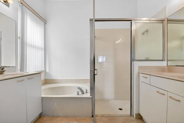 a bathroom with a shower and a bathtub