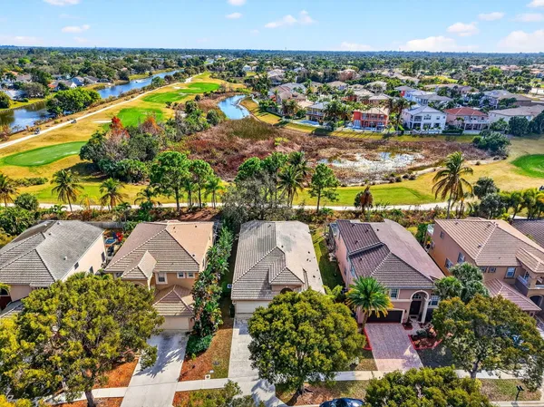 an aerial view of residential houses with outdoor space