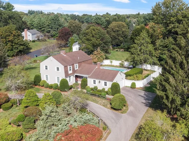 an aerial view of a house with yard