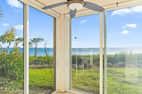 a bathroom with a glass door and shower
