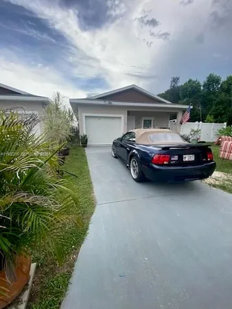 a car parked in front of a house