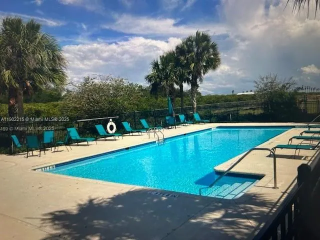 a view of a lake with a swimming pool