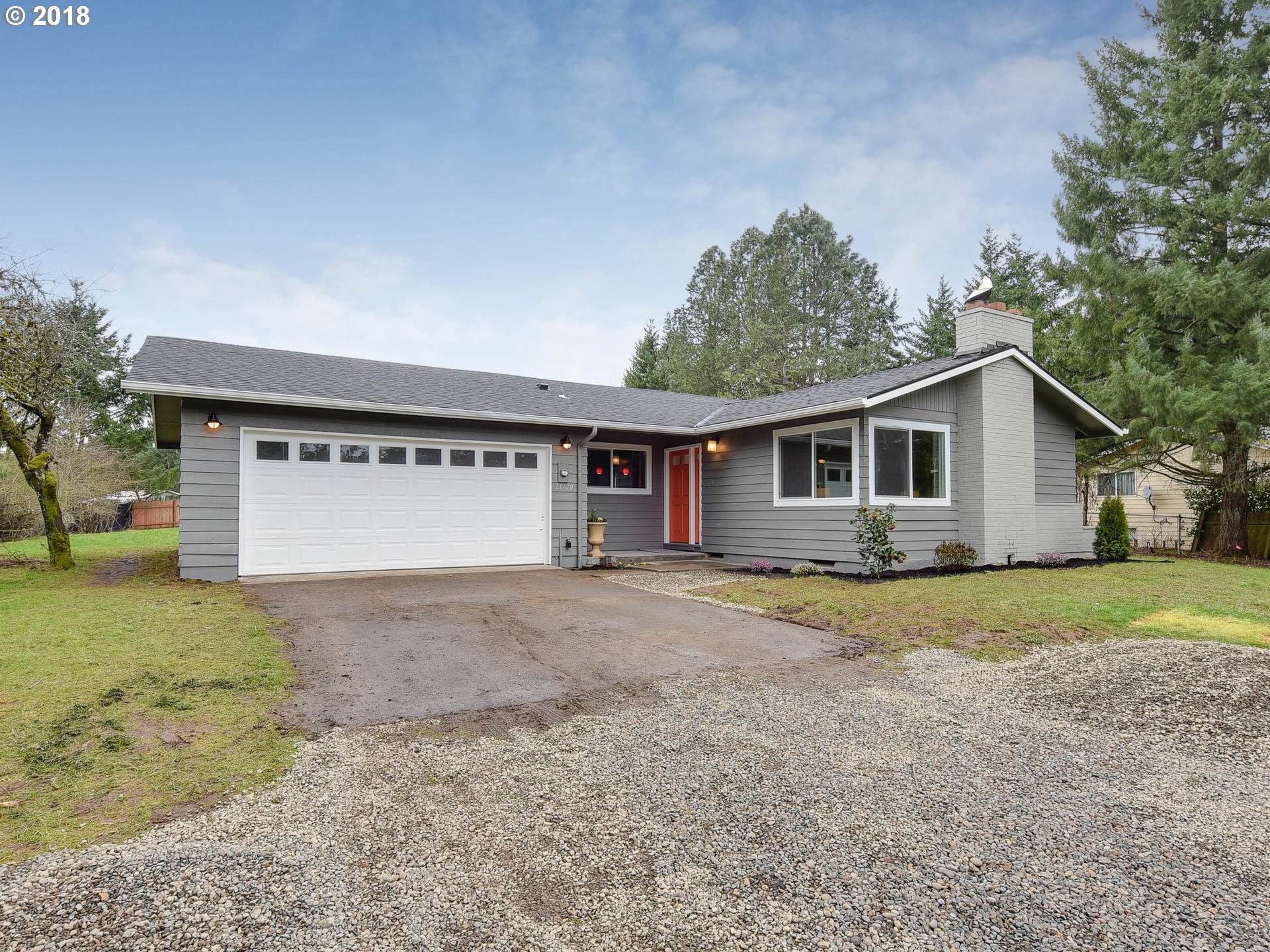21130 Southeast Foster Road Damascus, OR 97089 - Photo 1 of 30 a view of a house with a yard and large tree
